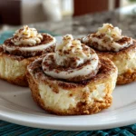 Beautiful cinnamon roll cheesecake cookies on a white plate