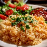 Home Cook, taken with iPhone 14 Pro. Close-up slight angle of freshly prepared Texas Roadhouse Seasoned Rice on white plate. Warm appetizing --ar 4:3 --style raw --s 270