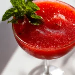 home cook, taken with iPhone 15 Pro. Close-up slight angle of freshly prepared Strawberry Daiquiri on white plate. fresh vibrant --ar 4:3 --style raw --s 240